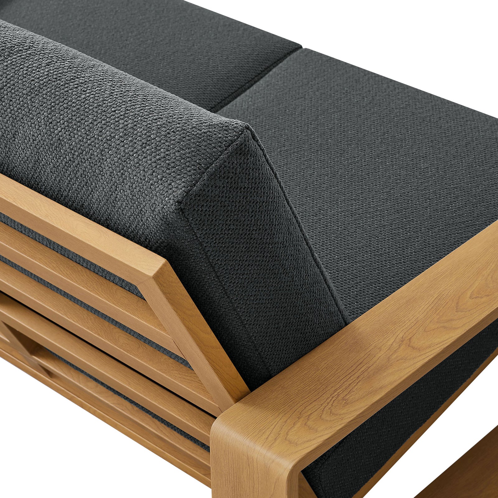 Charcoal fabric texture contrasts with the warm faux wood grain along the loveseat's back || EEI-7297-CHA-NAT || detail_studio