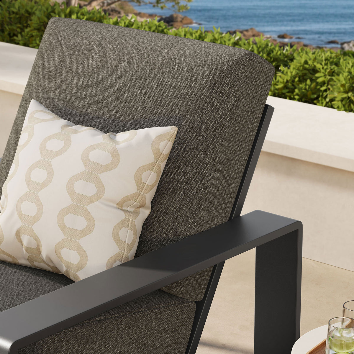 Smoke gray cushion and charcoal arm detail bring cozy depth to an inviting outdoor retreat || EEI-7300-SMO-GRY || detail_room