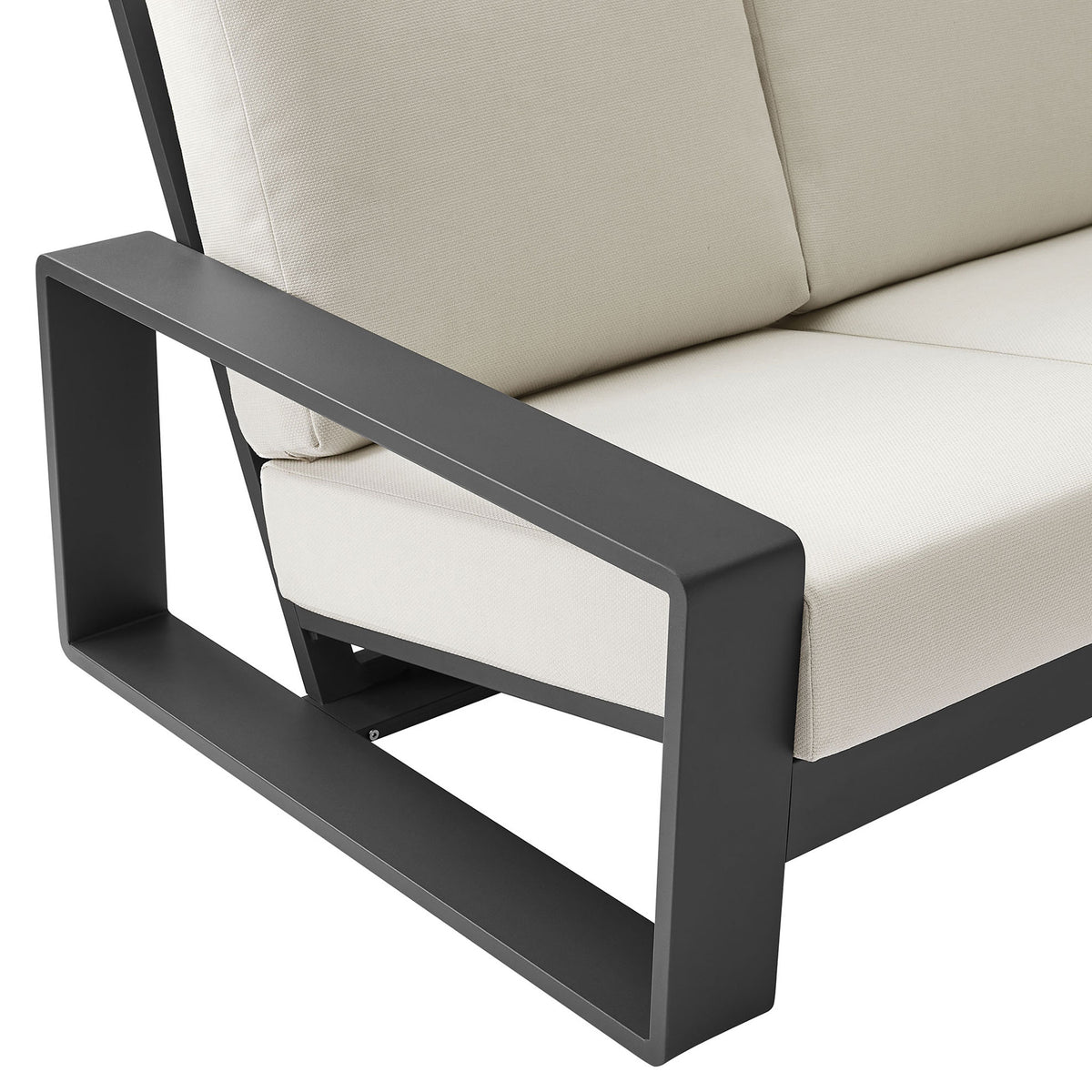 Charcoal aluminum arm and thick cream cushion showcasing the sofa's crisp modern lines || EEI-7302-CRE-GRY || detail_studio