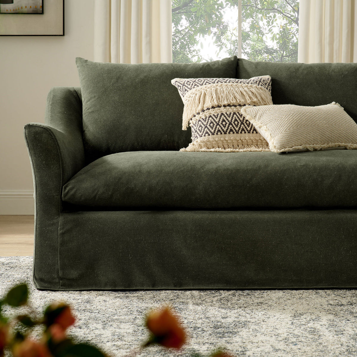 Somerset sofa styled with textured accent pillows, showcasing its generous seat depth and soft sage upholstery || EEI-7310-SGE || detail_room