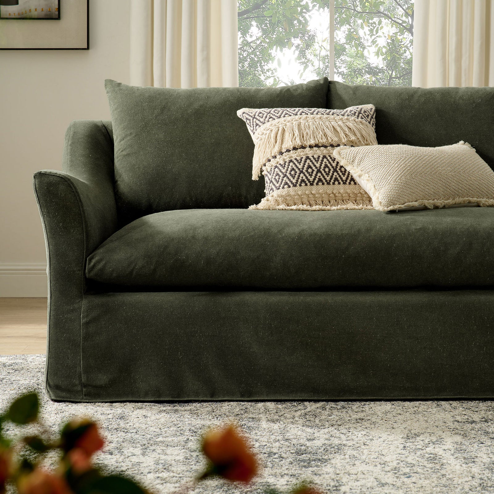 Somerset sofa styled with textured accent pillows, showcasing its generous seat depth and soft sage upholstery || EEI-7310-SGE || detail_room