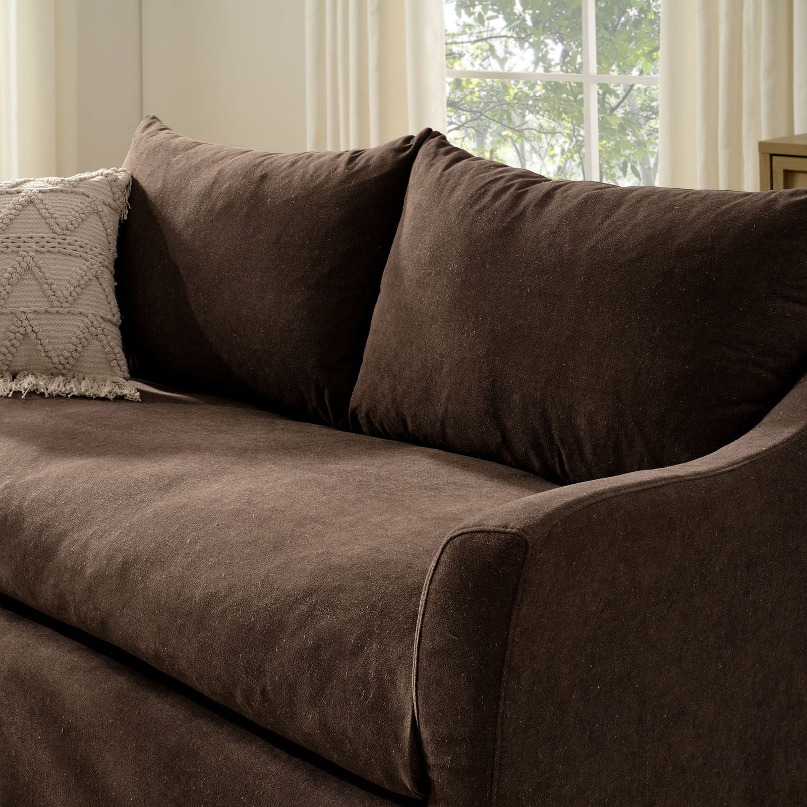 Cocoa loveseat styled with a textured accent pillow in an airy neutral living room || EEI-7311-COA || detail_room