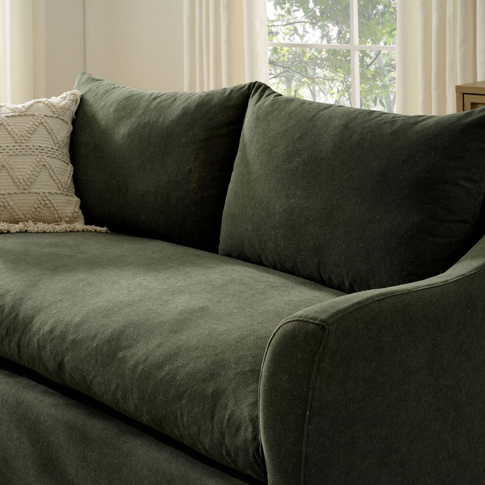 Cozy in-room detail of the Somerset loveseat in sage, featuring a deep cushion and inviting, textured fabric || EEI-7311-SGE || detail_room