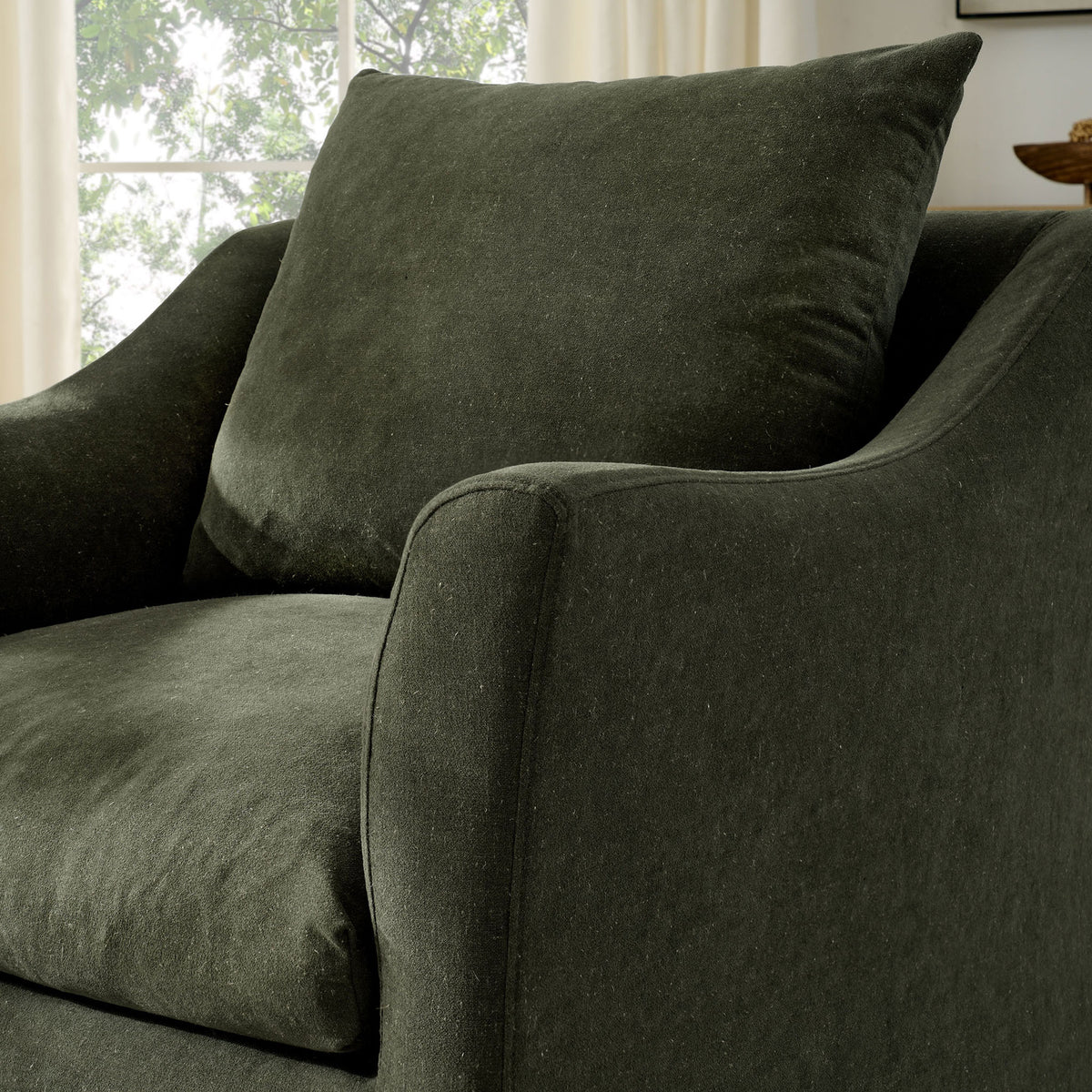 Softly curved arm and textured sage fabric add inviting comfort to contemporary spaces || EEI-7312-SGE || detail_room