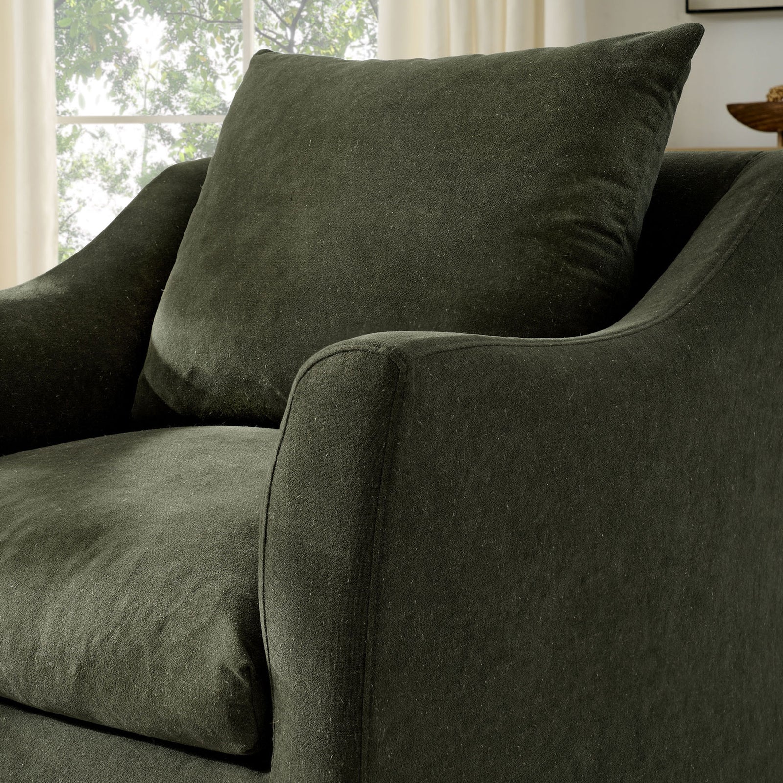 Softly curved arm and textured sage fabric add inviting comfort to contemporary spaces || EEI-7312-SGE || detail_room