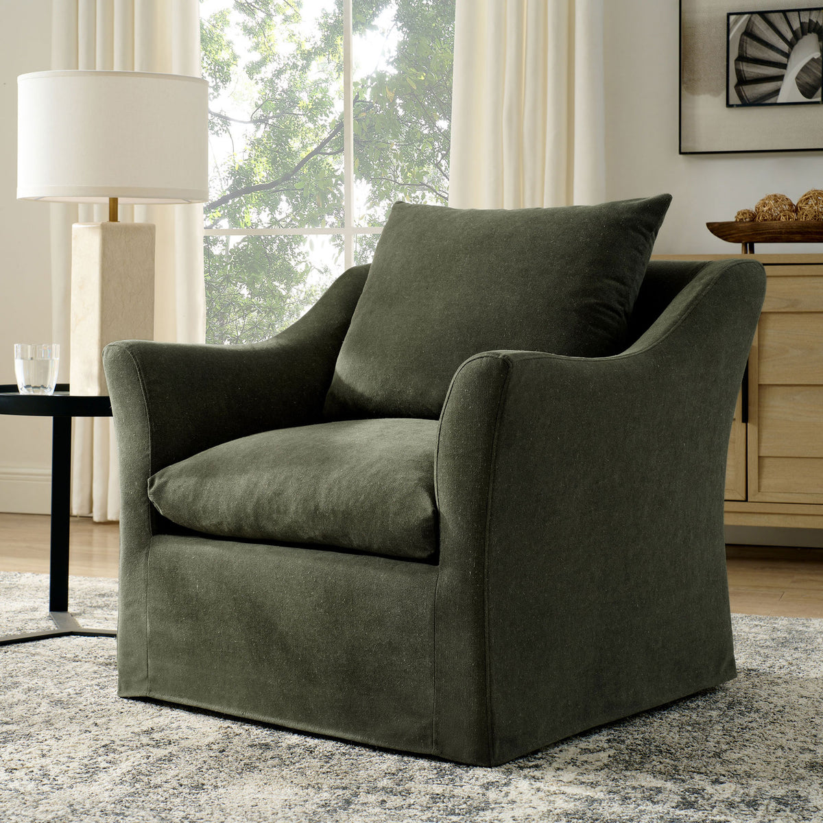 Sage armchair brings easygoing comfort and modern simplicity to the living room || EEI-7312-SGE || front_angle_room