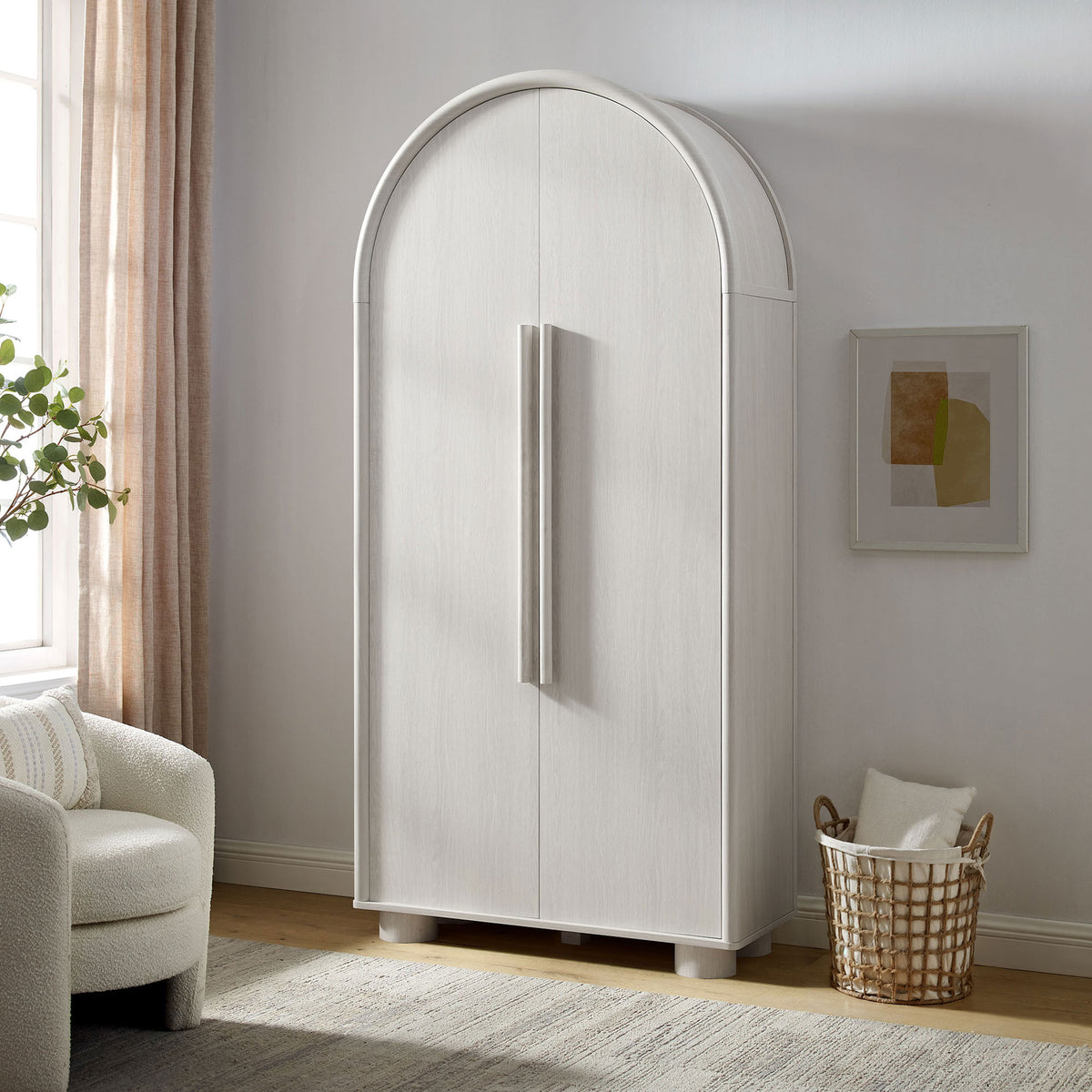 Bellamy ash tall arched storage cabinet styled in a cozy living room with soft natural light || EEI-7313-ASH || front_angle_room
