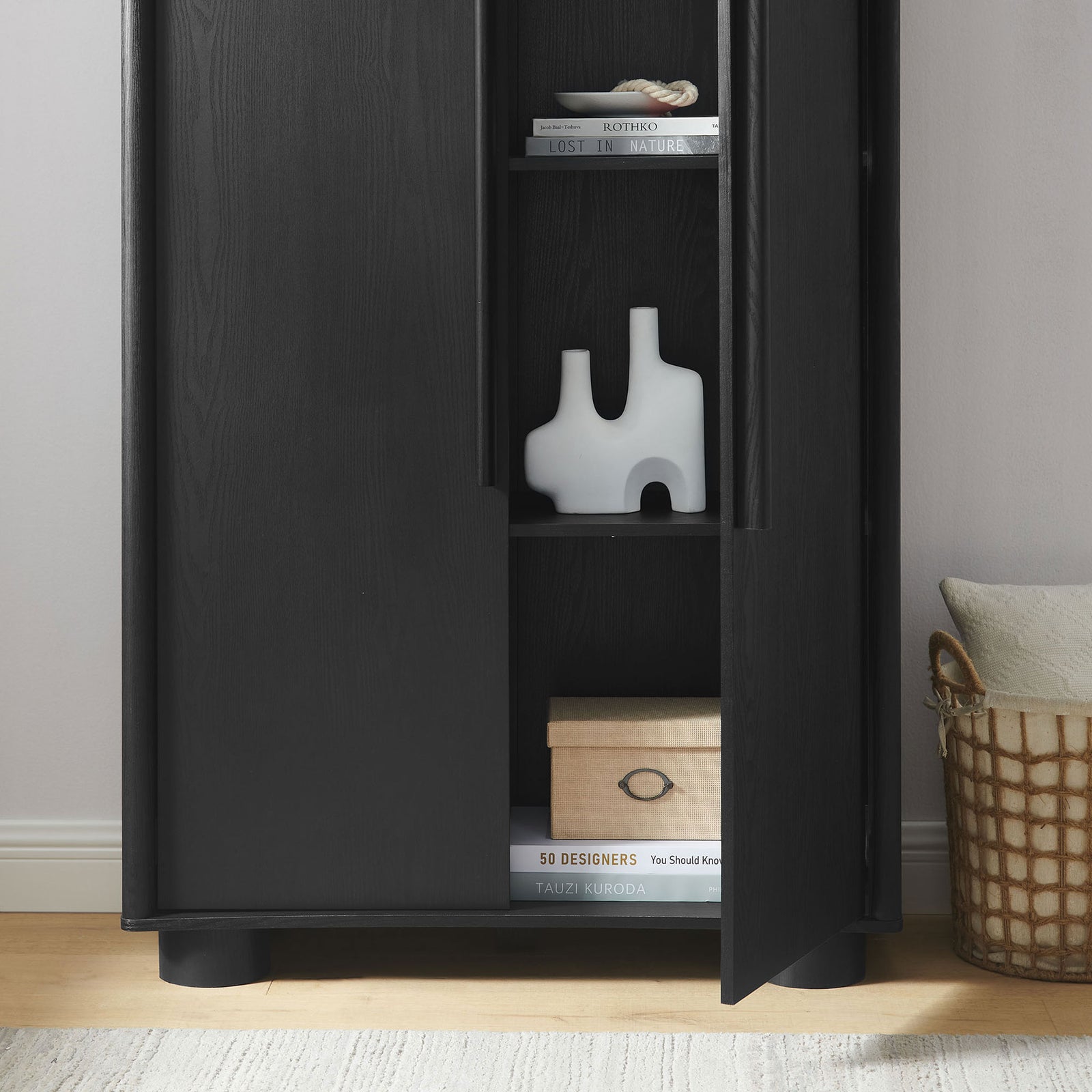 Styled Bellamy black cabinet with open shelves displaying decor accents, books, and storage box || EEI-7313-BLK || storage_open_room