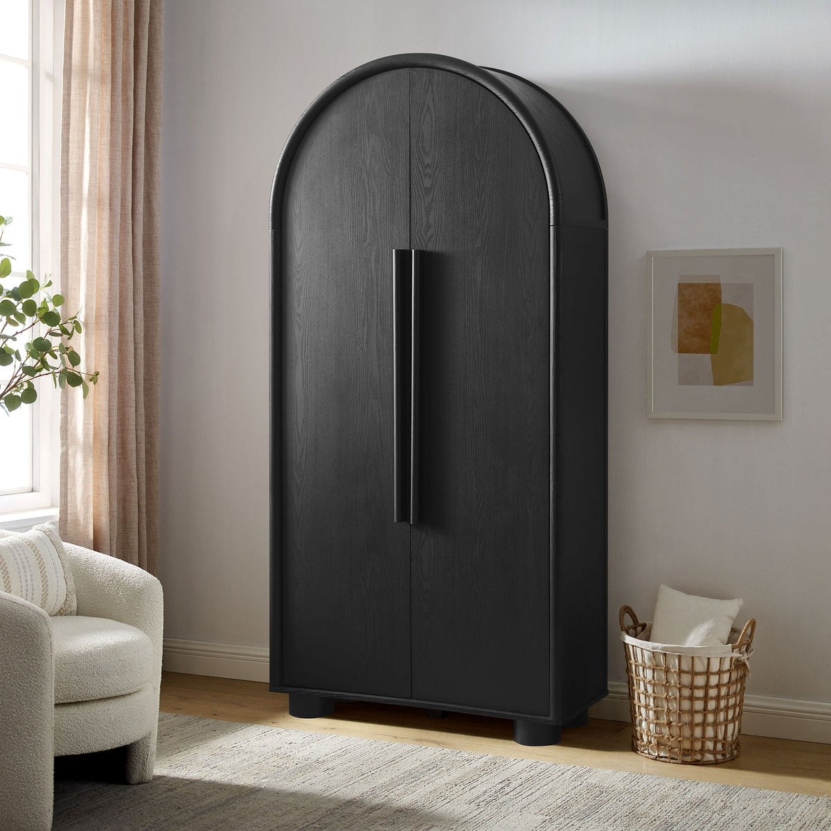 Bellamy black tall arched storage cabinet styled in a modern living room with soft light || EEI-7313-BLK || front_angle_room