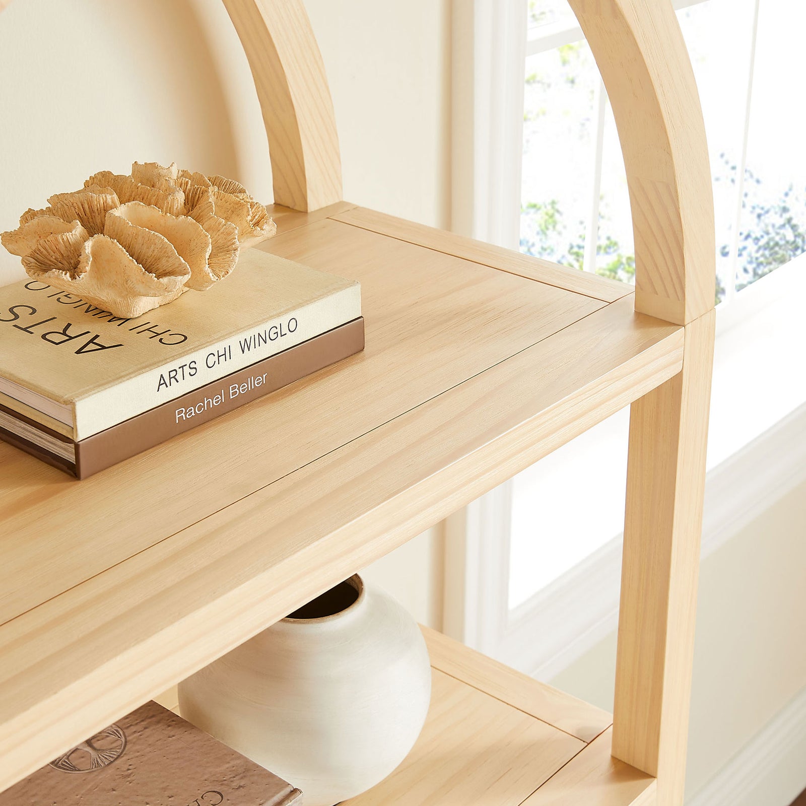 Arch top and open shelves elevate decor, offering airy display space with a natural wood look || EEI-7317-NAT || detail_room