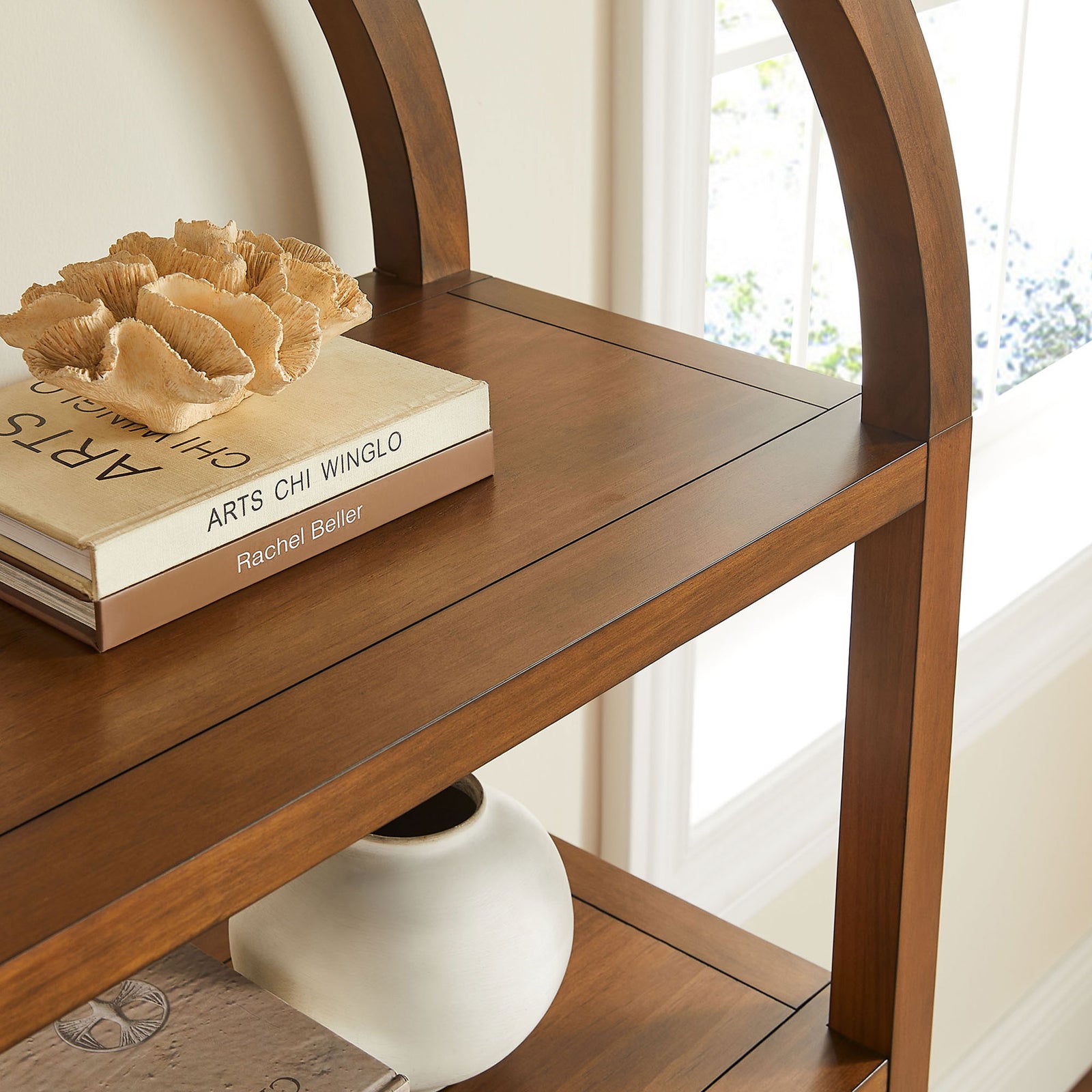 Smooth shelves and rounded arches create a modern focal point for styled vignettes || EEI-7317-WAL || detail_room