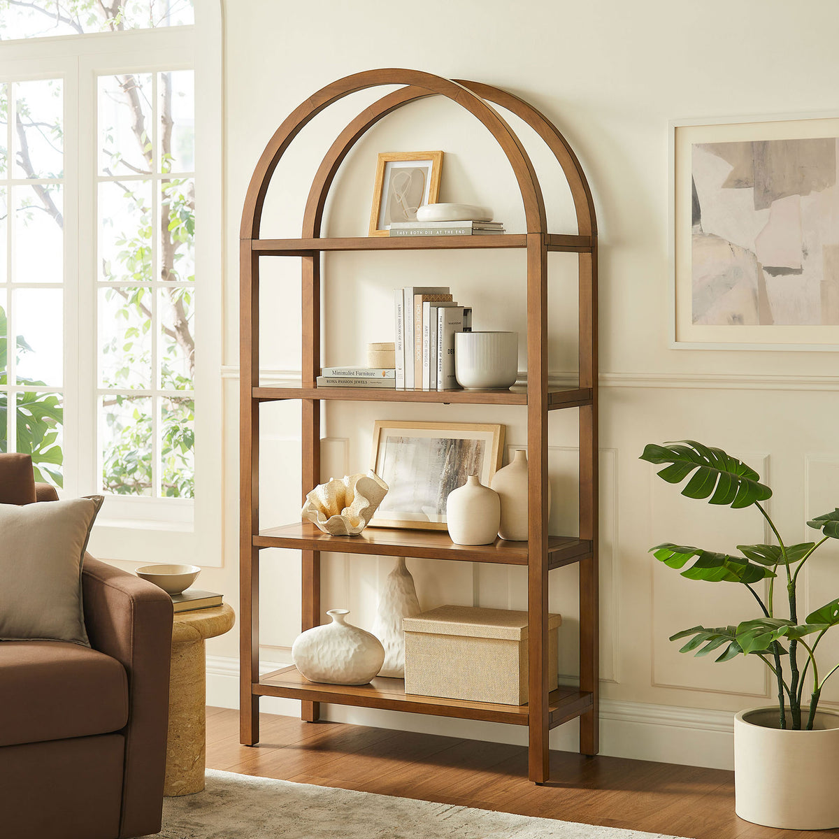 Large arched bookshelf anchors the room with sculptural form and ample storage || EEI-7318-WAL || front_angle_room