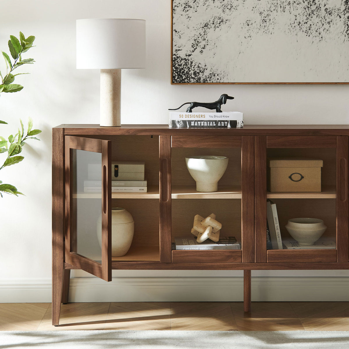 Styled sideboard shows open glass door with decor arranged on the spacious interior shelves || EEI-7319-WAL-ASH || storage_open_room