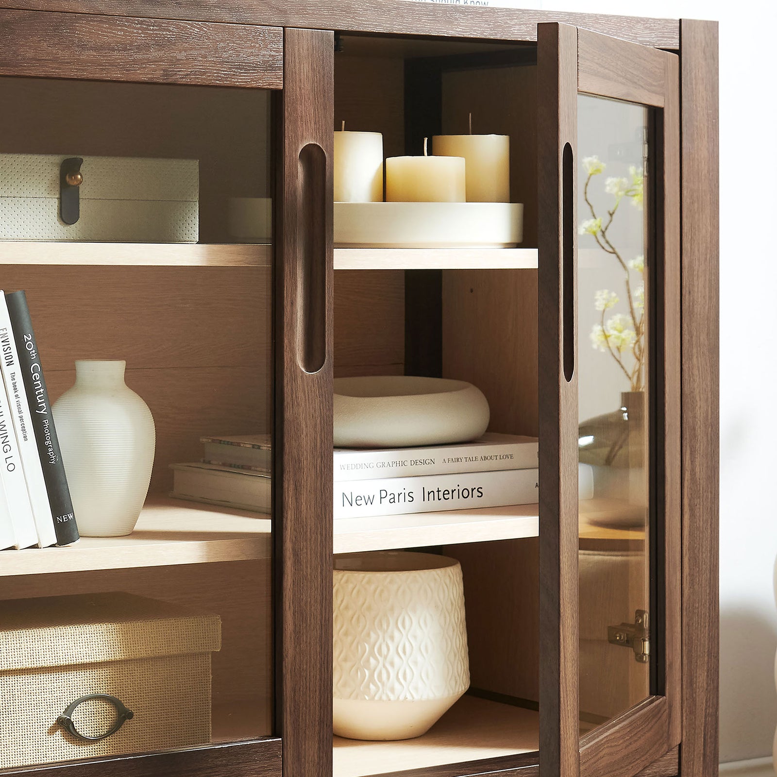 Nell accent cabinet displaying candles, books, and decor through clear glass doors in a warm walnut finish || EEI-7321-WAL-ASH || detail_room
