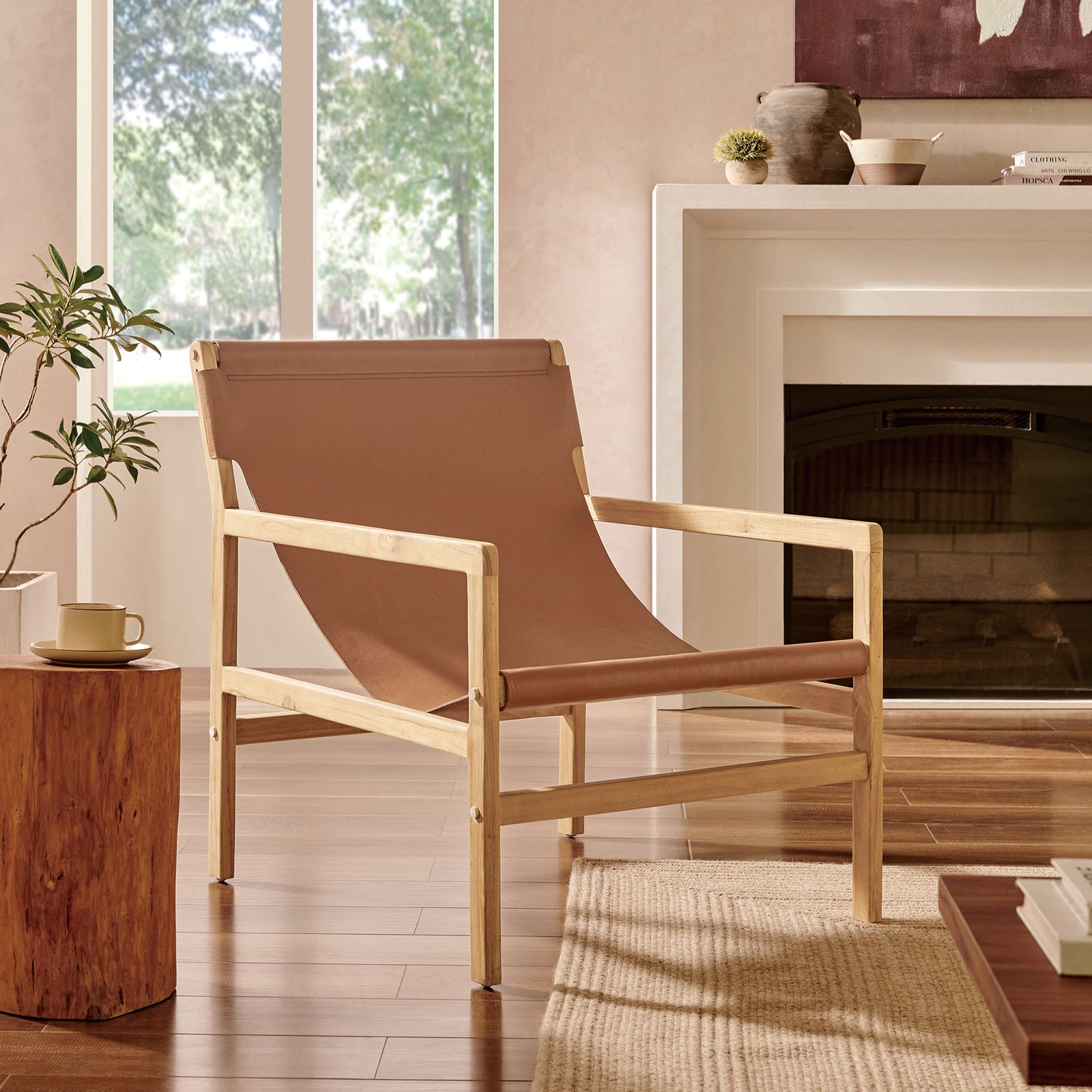 Warm chestnut leather and airy teak frame bring inviting texture to any living space || EEI-7324-CSN || front_angle_room