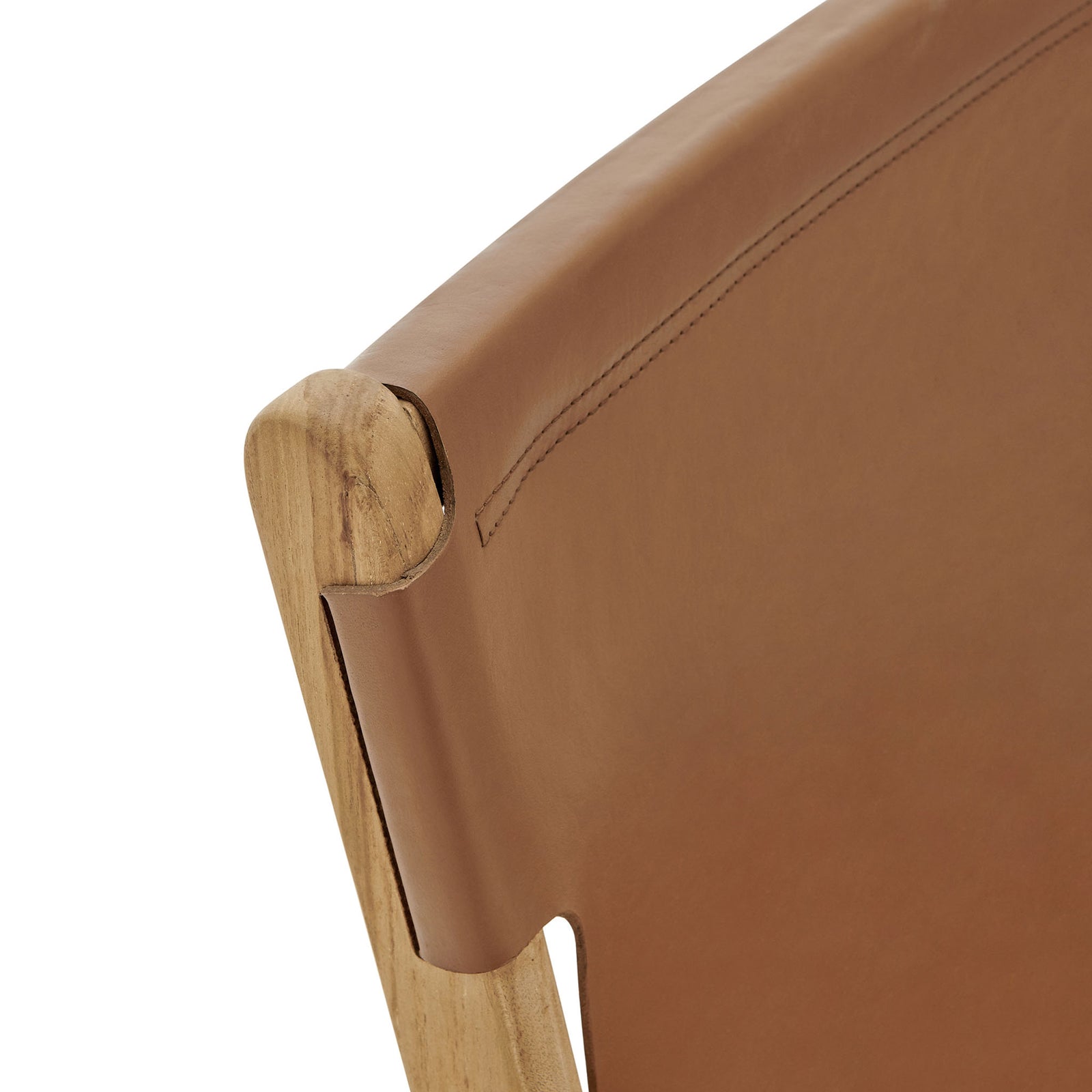 Curved teak backrest wrapped in chestnut leather, showcasing tailored stitching and artisanal joinery || EEI-7326-CSN || detail_studio