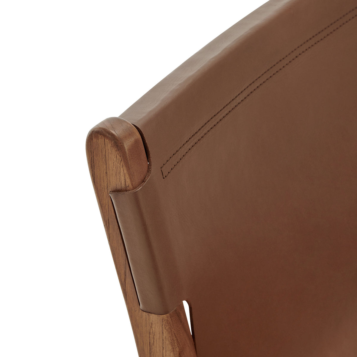 Curved leather backrest wraps smoothly around the solid teak frame || EEI-7326-NUT || detail_studio