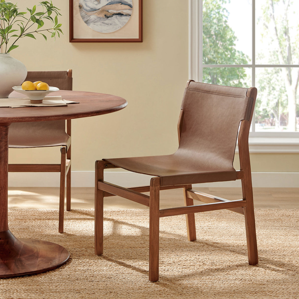 Sonora dining chair brings nutmeg brown leather and teak warmth to a modern dining room || EEI-7326-NUT || front_angle_room