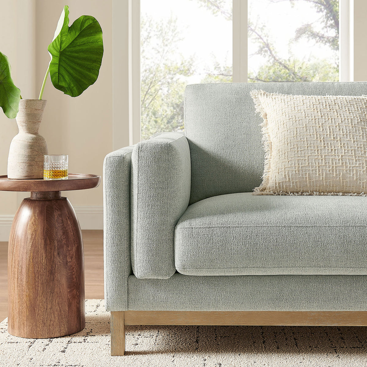 Roscoe mist sofa styled with accent pillow and side table for inviting living room comfort || EEI-7327-MST || detail_room