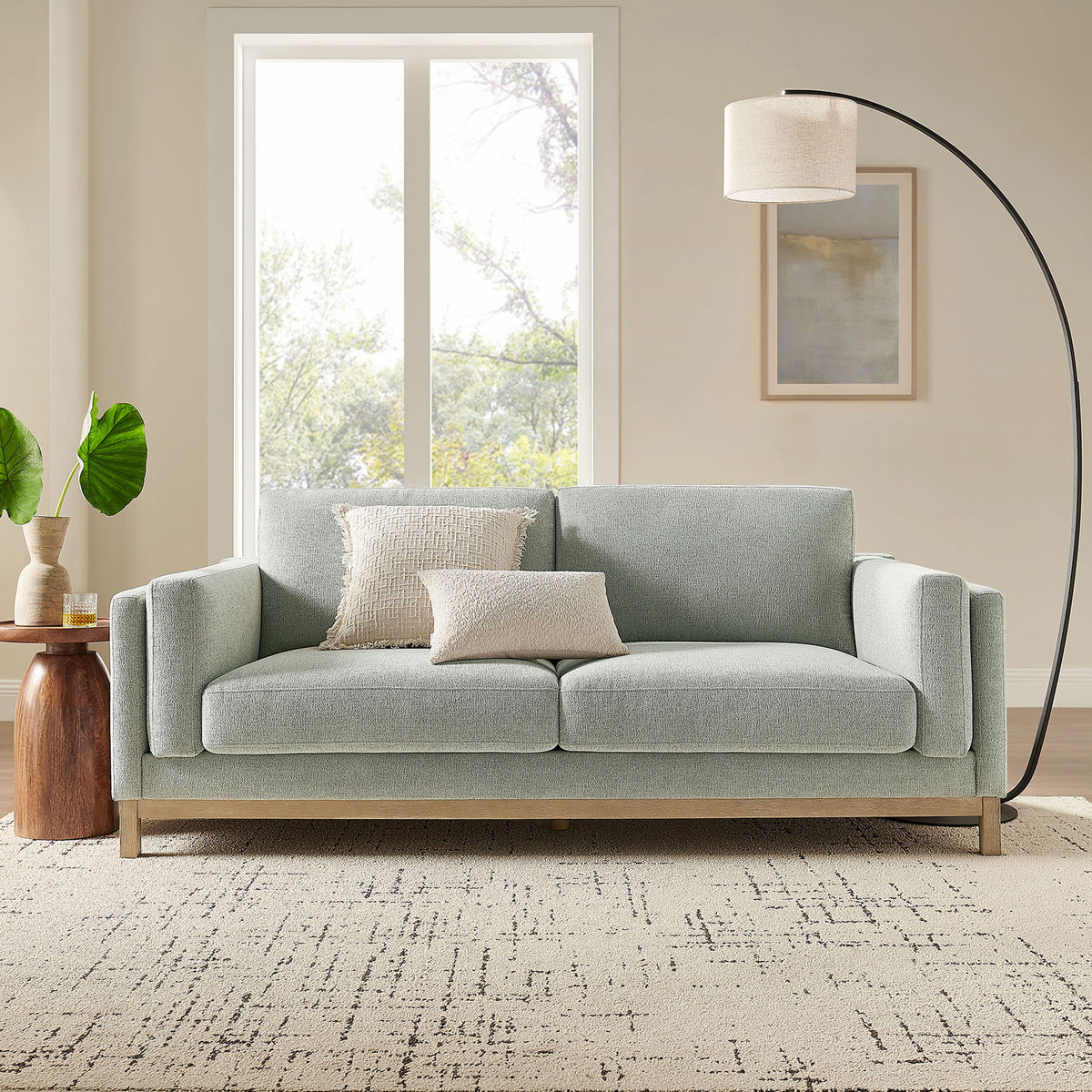 Roscoe mist fabric sofa with deep cushions and wood base creating a modern living room centerpiece || EEI-7327-MST || front_room