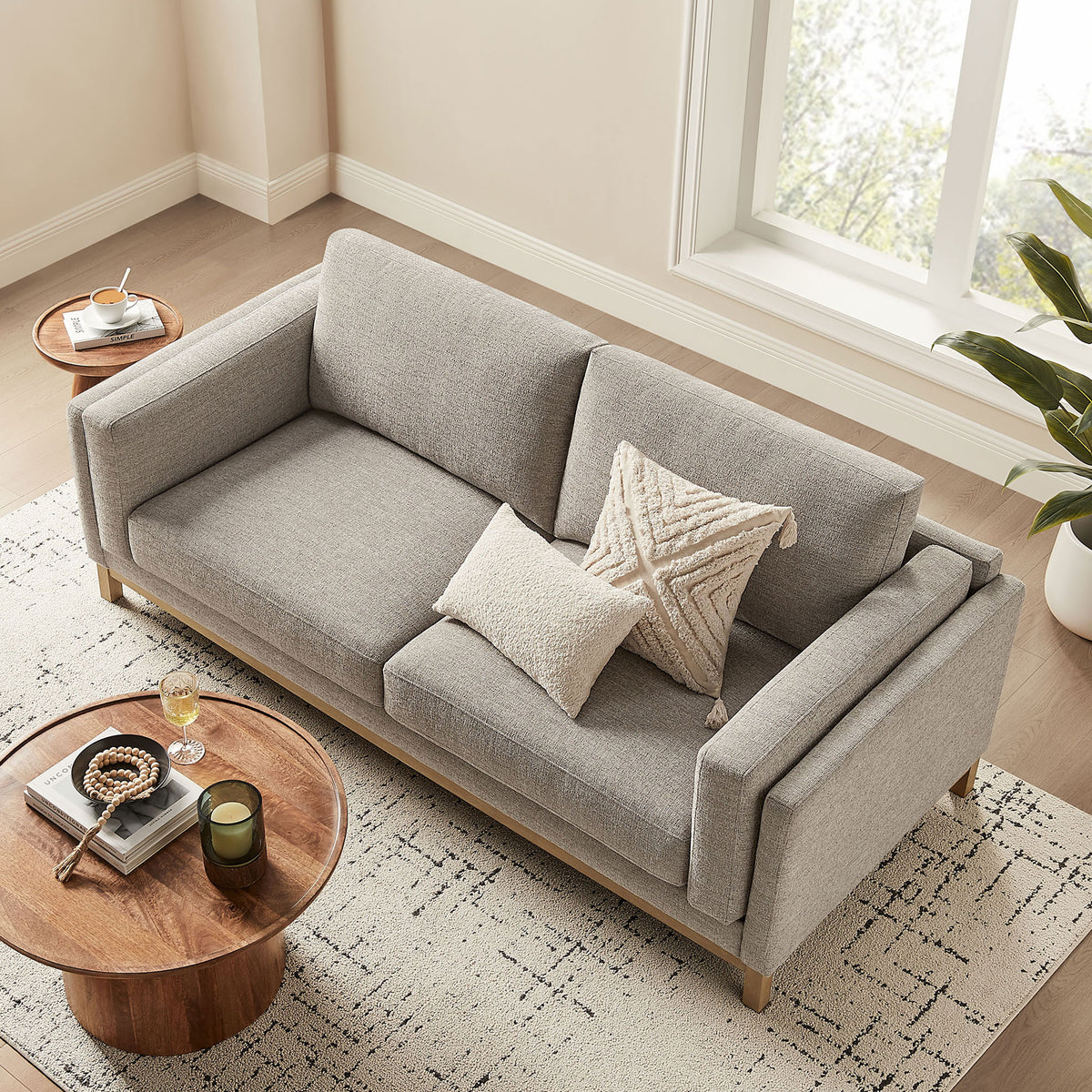 Roscoe sofa in a bright living space showcasing deep seat cushions and an inviting lounge layout || EEI-7327-PEW || top_angle_room