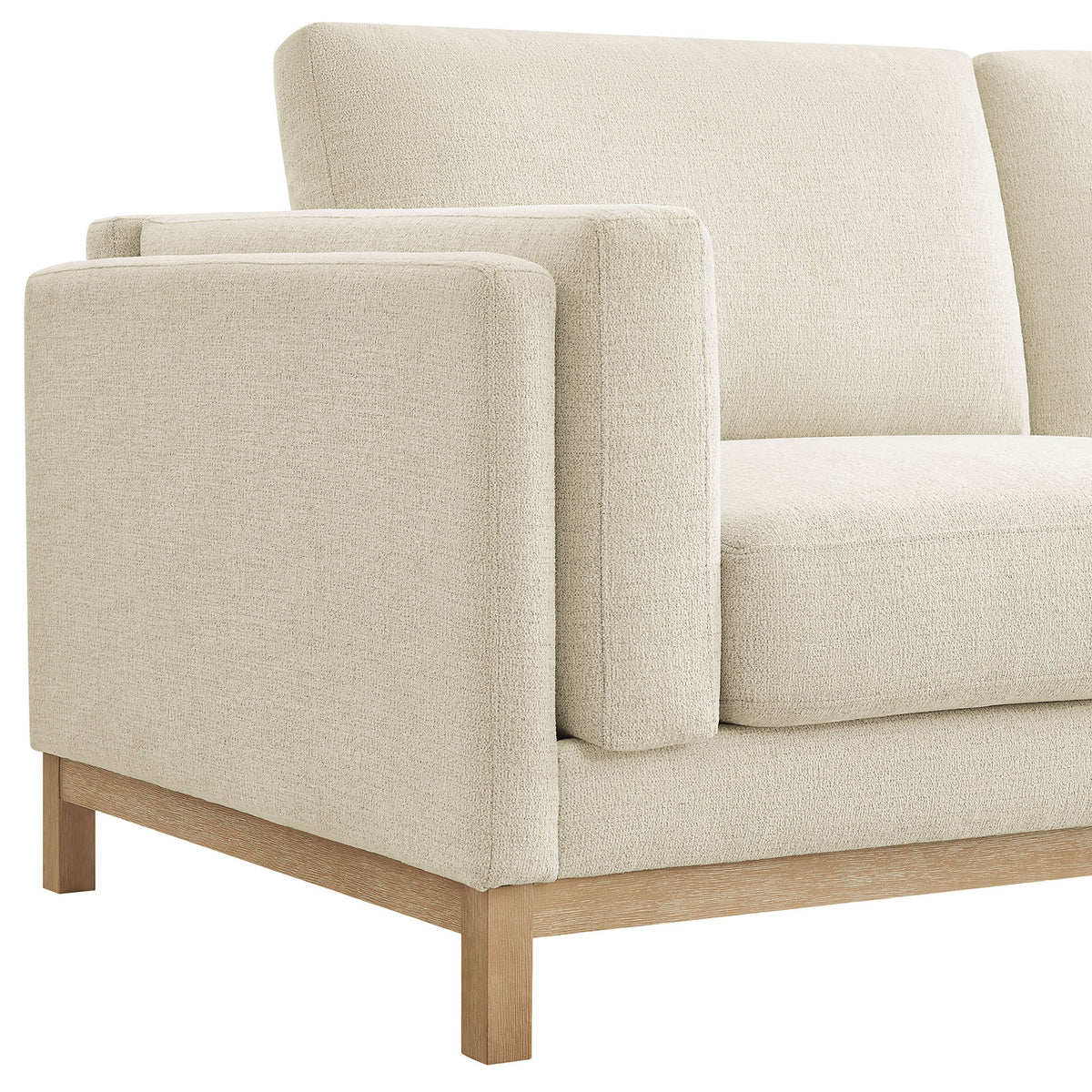 Detail of the wrapped armrest, plush seat cushioning, and natural wood base. || EEI-7328-IVO || detail_studio