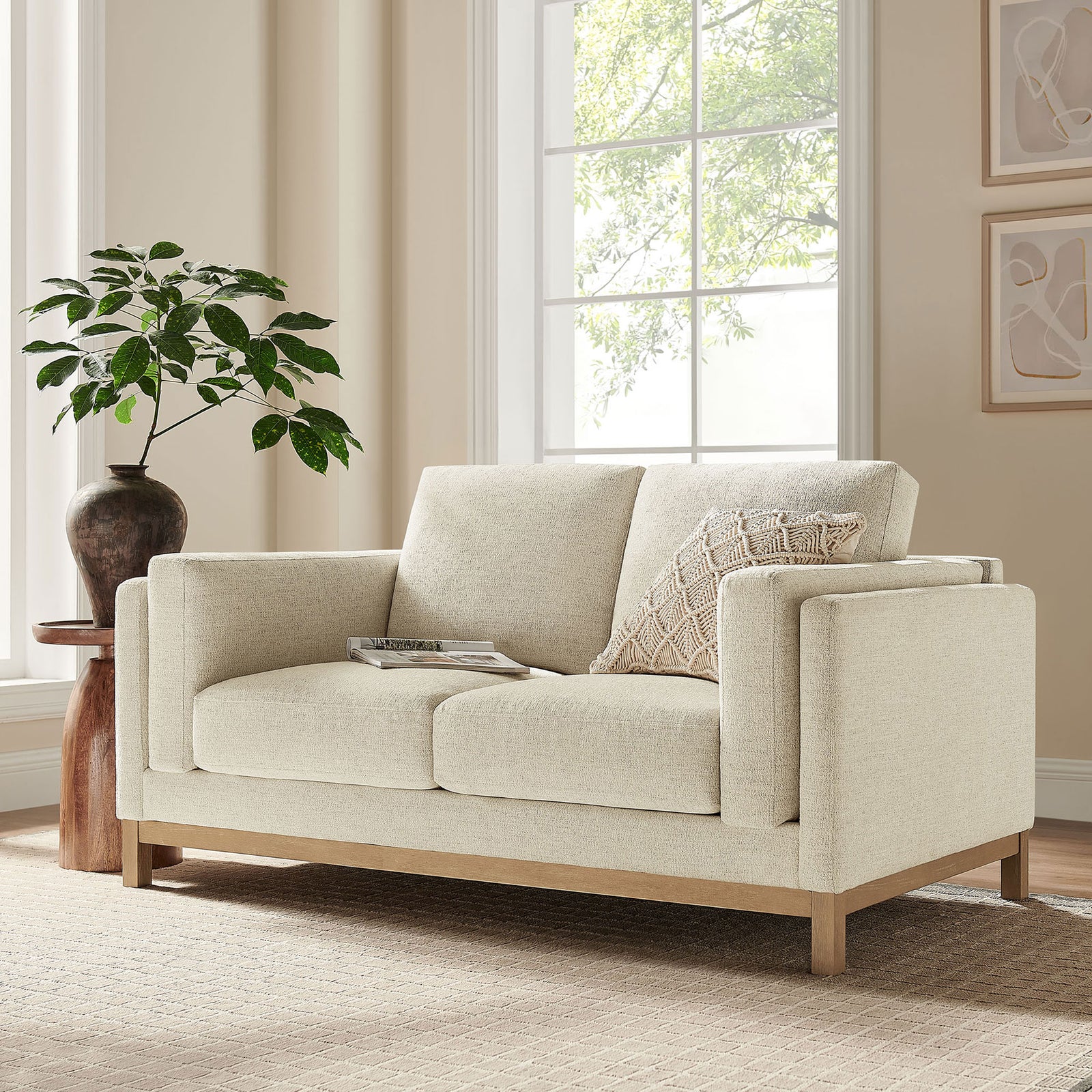Roscoe ivory loveseat anchored on a neutral rug with modern decor for relaxed living spaces. || EEI-7328-IVO || front_angle_room