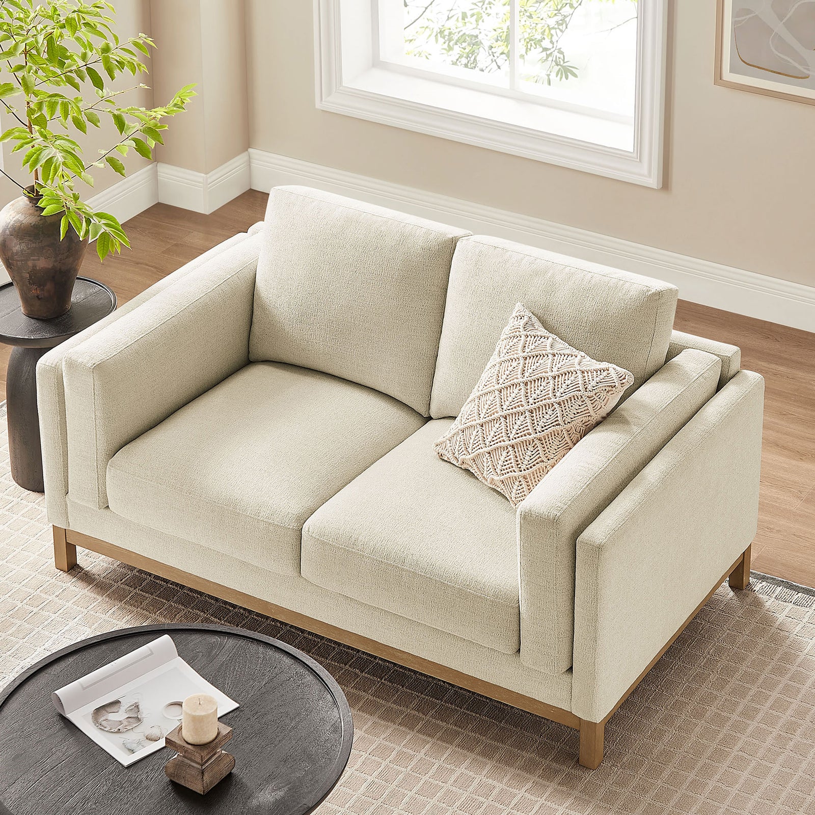Wide, deep cushions and slim arms showcase the loveseat's spacious, lounge-ready seating. || EEI-7328-IVO || top_angle_room
