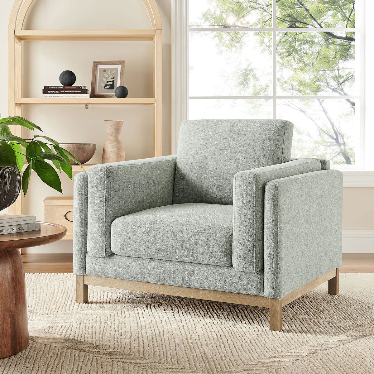Comfortable accent chair elevates living spaces with airy mist upholstery and warm wood || EEI-7329-MST || front_angle_room