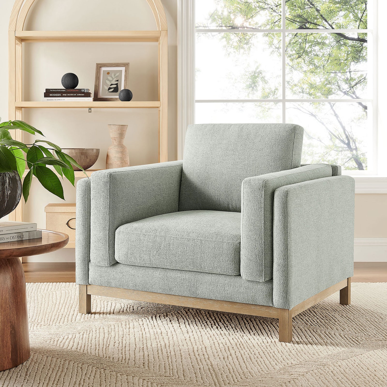 Comfortable accent chair elevates living spaces with airy mist upholstery and warm wood || EEI-7329-MST || front_angle_room