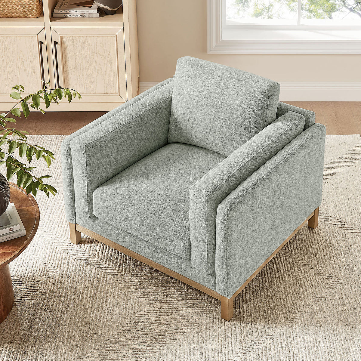 Cozy lounge chair pairs plush support with clean lines for modern living rooms || EEI-7329-MST || top_angle_room