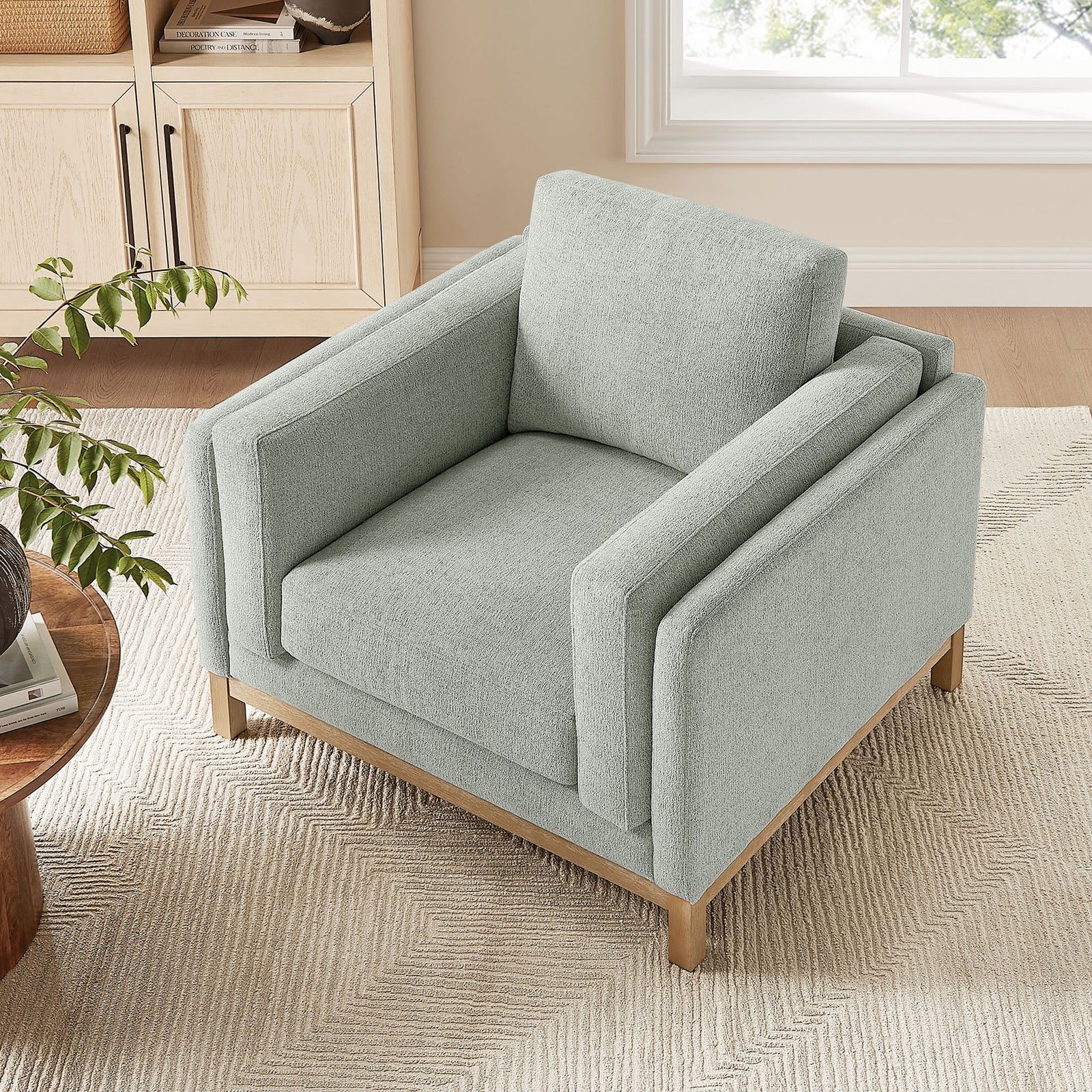 Cozy lounge chair pairs plush support with clean lines for modern living rooms || EEI-7329-MST || top_angle_room