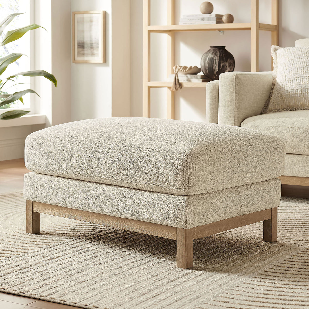 Ivory ottoman in bright living room paired with matching sofa and neutral decor || EEI-7330-IVO || front_angle_room