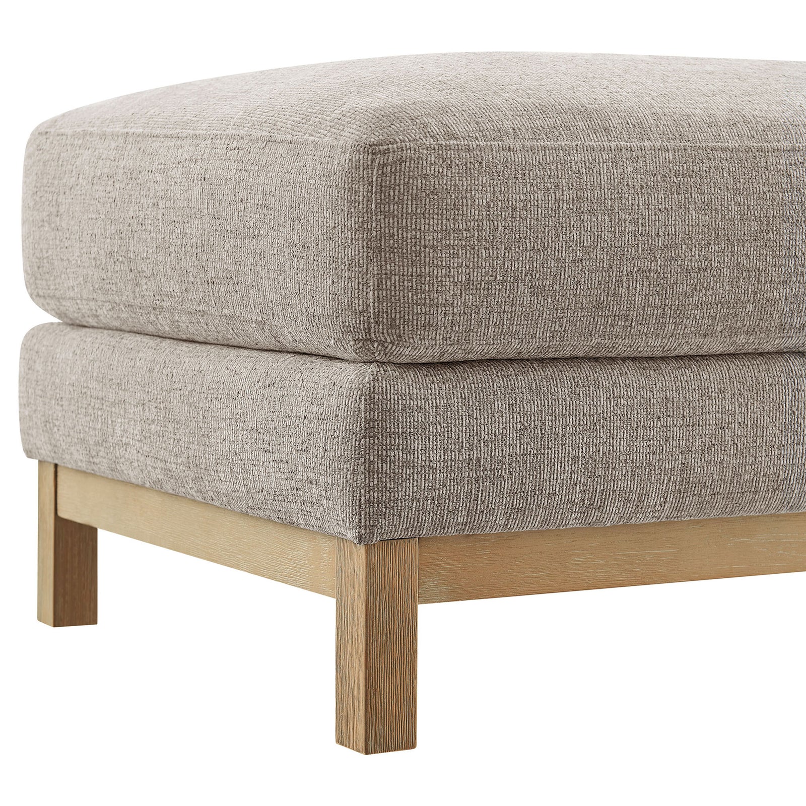 Tailored corner of the Roscoe ottoman showcases textured chenille upholstery and the warm wood leg. || EEI-7330-PEW || leg_studio