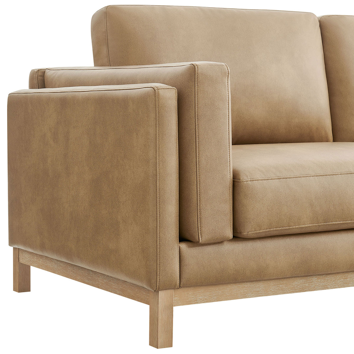 Roscoe sofa arm in soft vegan leather with crisp piping, neat tailoring, and deep seat cushion detail || EEI-7335-TST || detail_studio