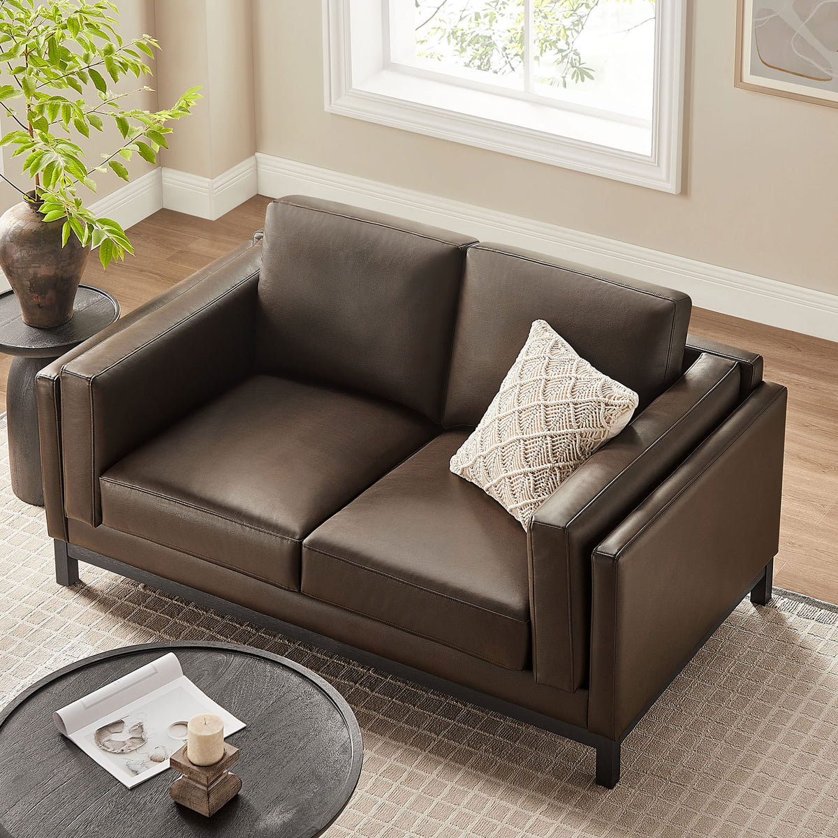 Compact loveseat arranged in a cozy seating area, highlighting deep two-seat cushions and slim track arms || EEI-7336-ESP || top_angle_room