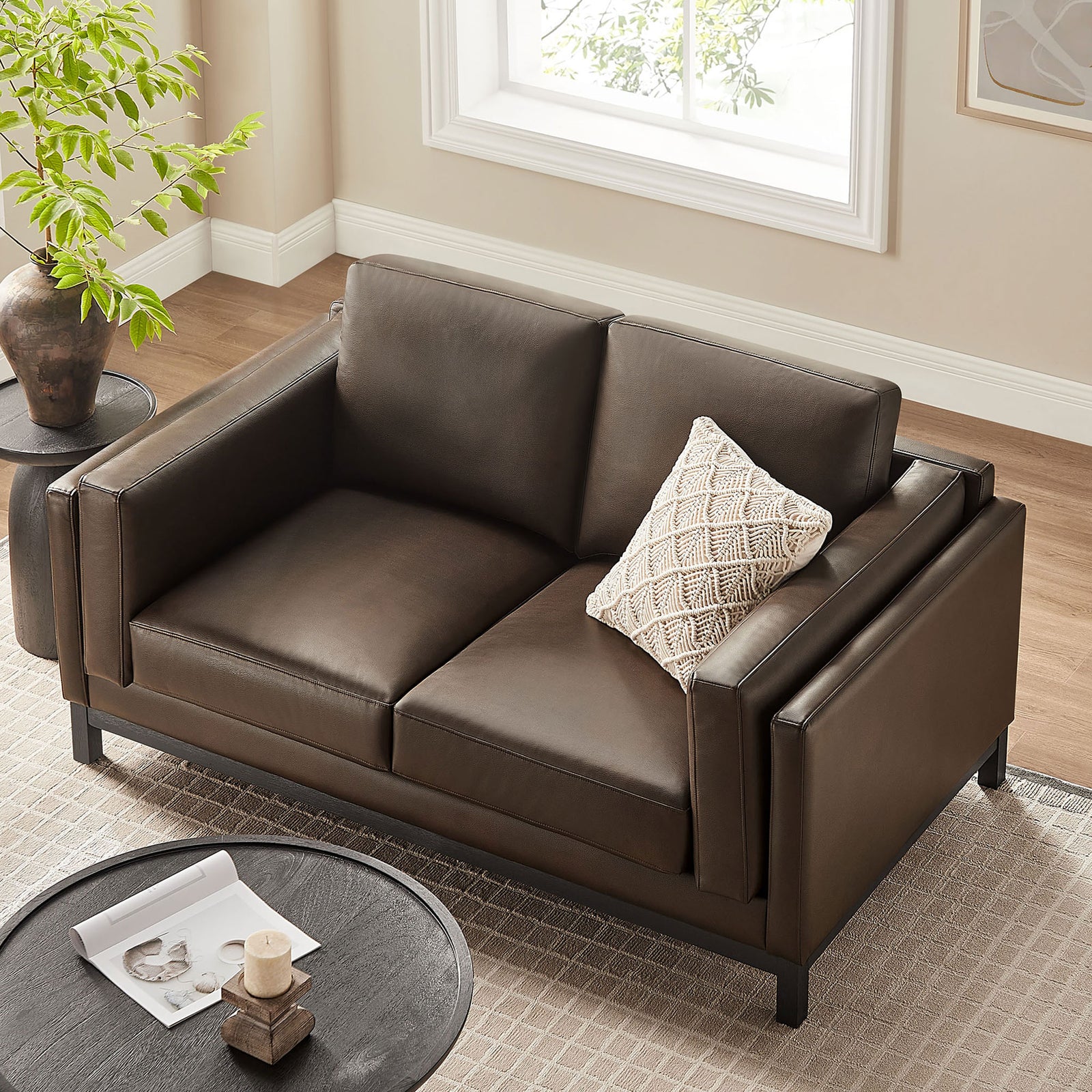 Compact loveseat arranged in a cozy seating area, highlighting deep two-seat cushions and slim track arms || EEI-7336-ESP || top_angle_room