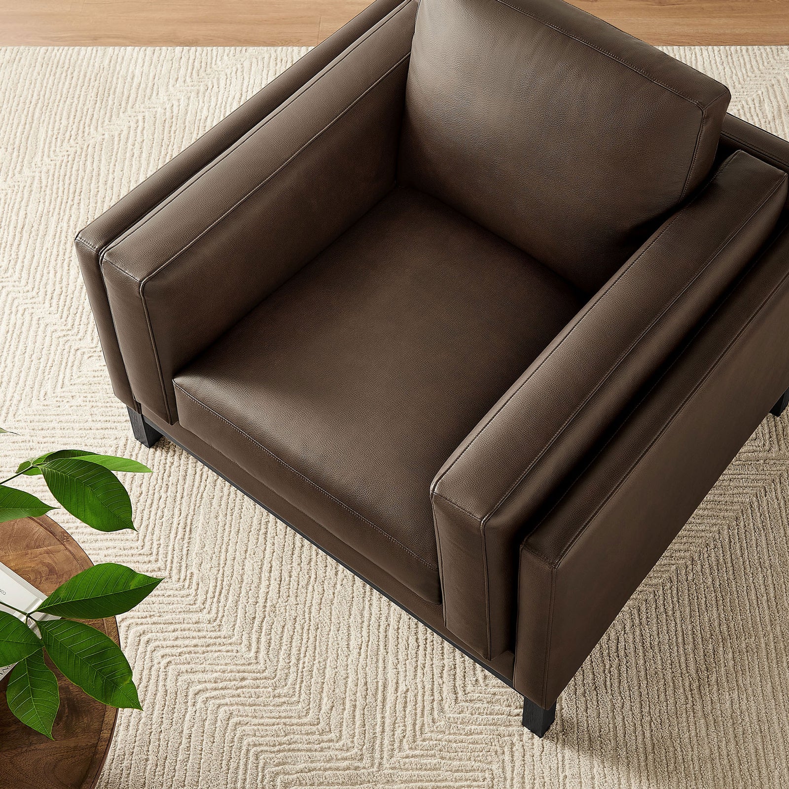 Deep, wide seat framed by substantial track arms, styled for cozy living rooms || EEI-7337-ESP || top_room