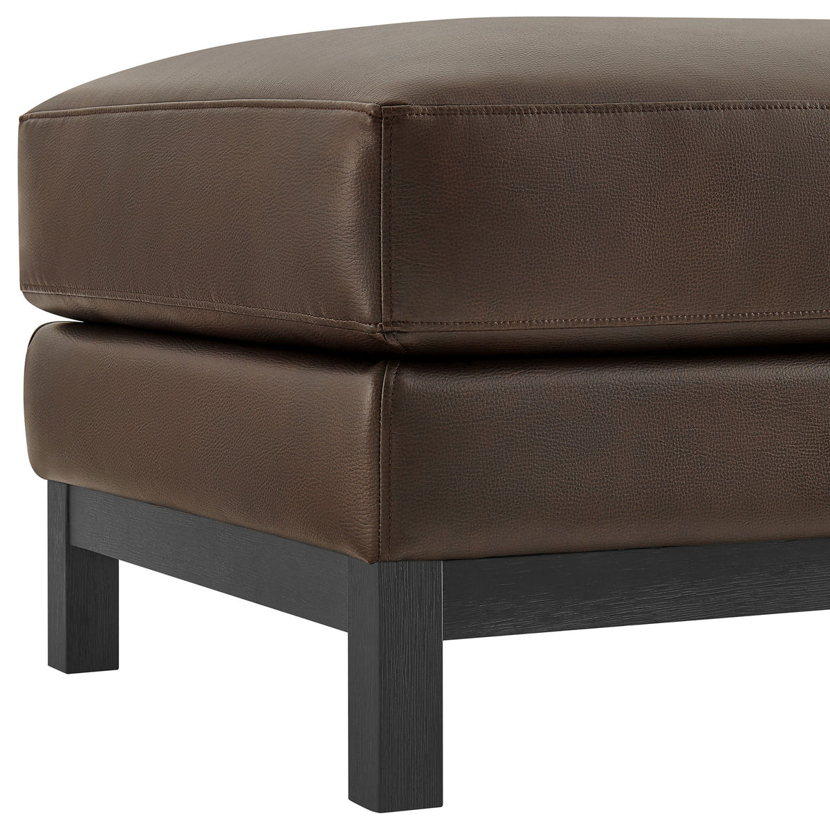 Detail of Roscoe ottoman corner with espresso vegan leather upholstery and square wood leg. || EEI-7338-ESP || leg_studio