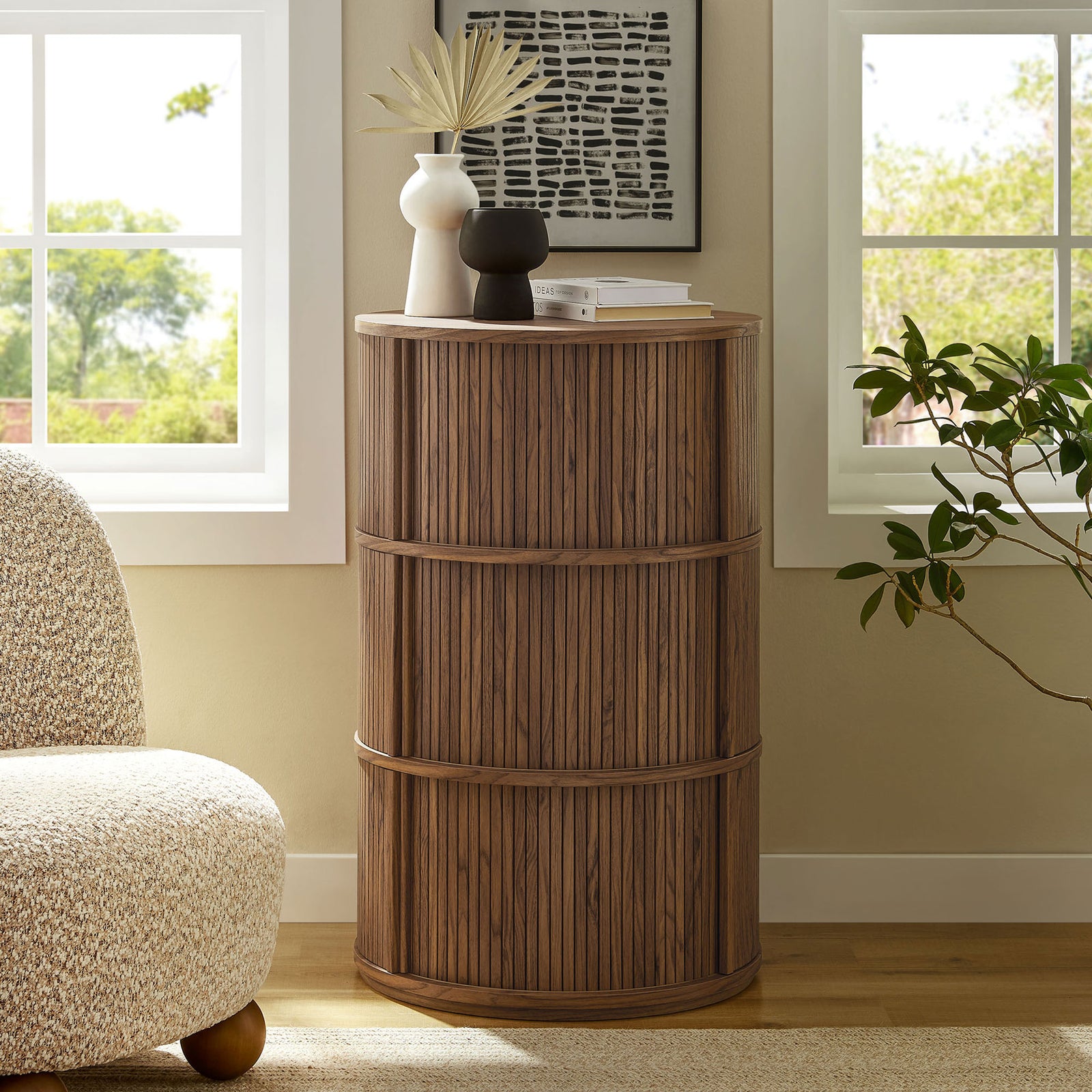 Walnut pedestal storage table anchoring a cozy living space with its tall fluted profile and hidden storage || EEI-7344-WAL || front_room