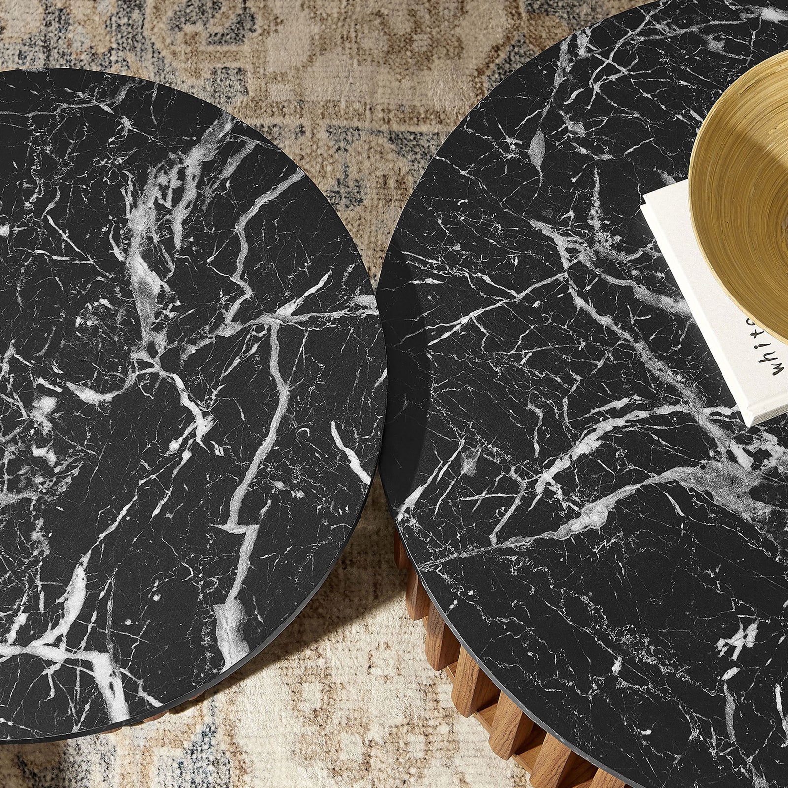 Dramatic veining and a smooth matte-black faux marble finish stand out on both tabletops. || EEI-7345-WAL-BLK || detail_room