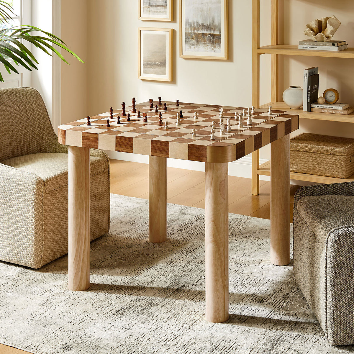 Oscar dining table doubles as a game table, easily set for an inviting chess match. || EEI-7351-OWC || front_angle_room