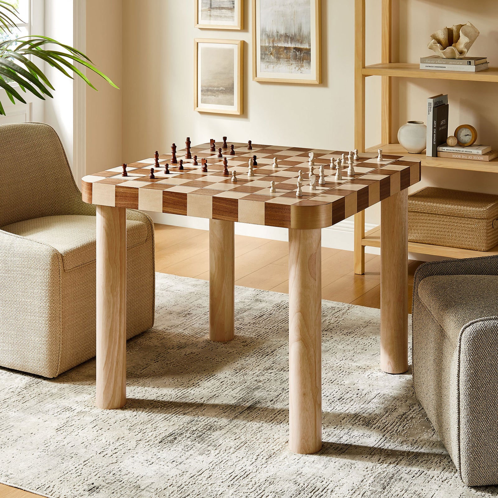 Oscar dining table doubles as a game table, easily set for an inviting chess match. || EEI-7351-OWC || front_angle_room