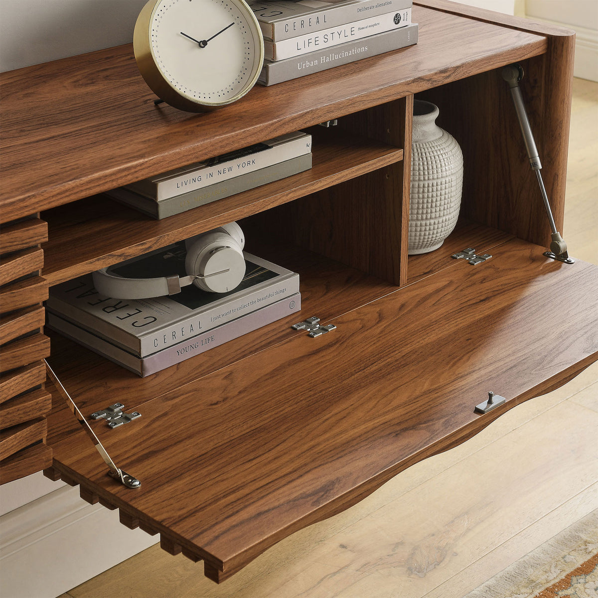 Floating TV cabinet with open drop-down door showing adjustable shelves and neatly stored living room essentials || EEI-7352-WAL || storage_open_room