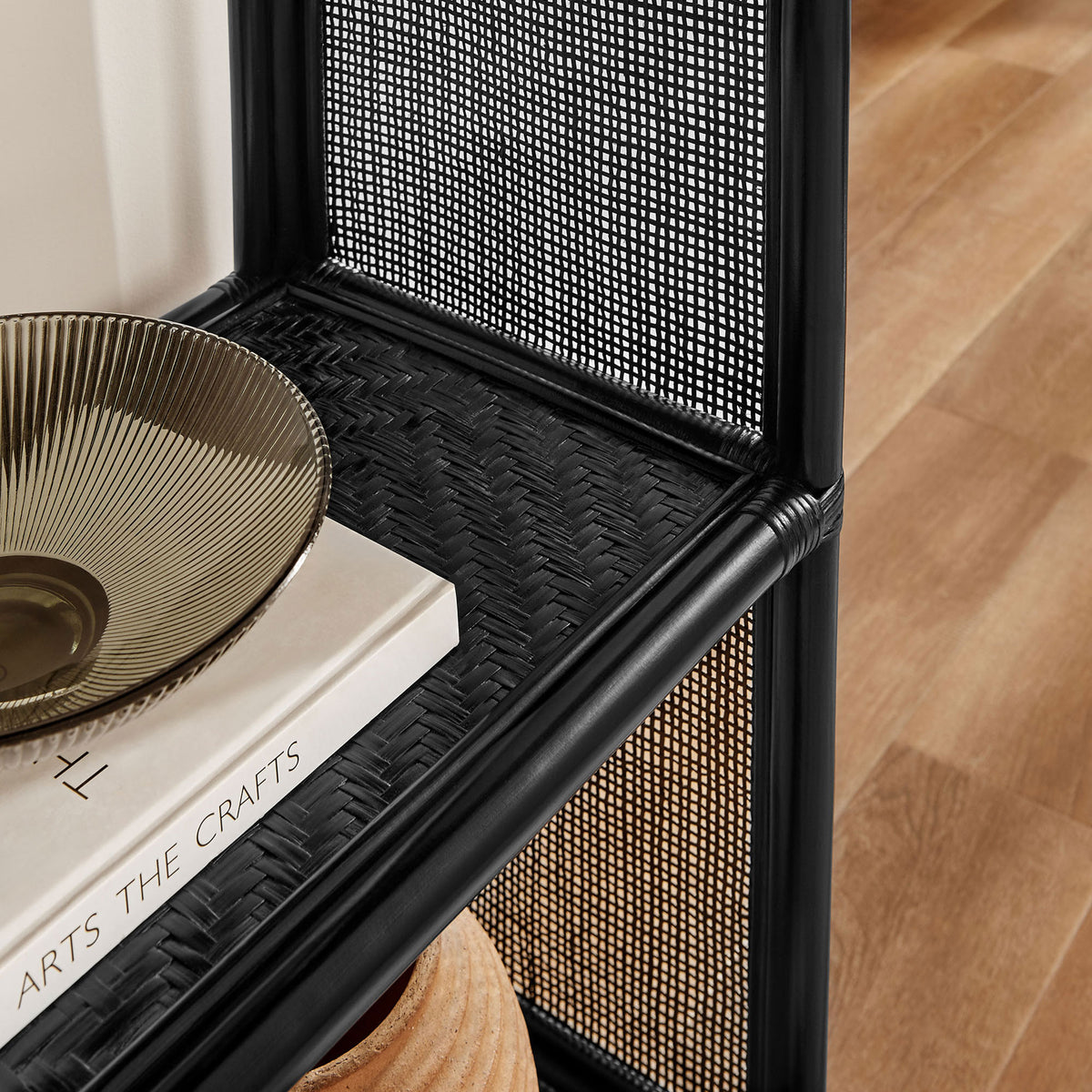Textured black rattan surface adds depth to styled shelves in a modern living space || EEI-7363-BLK || detail_room