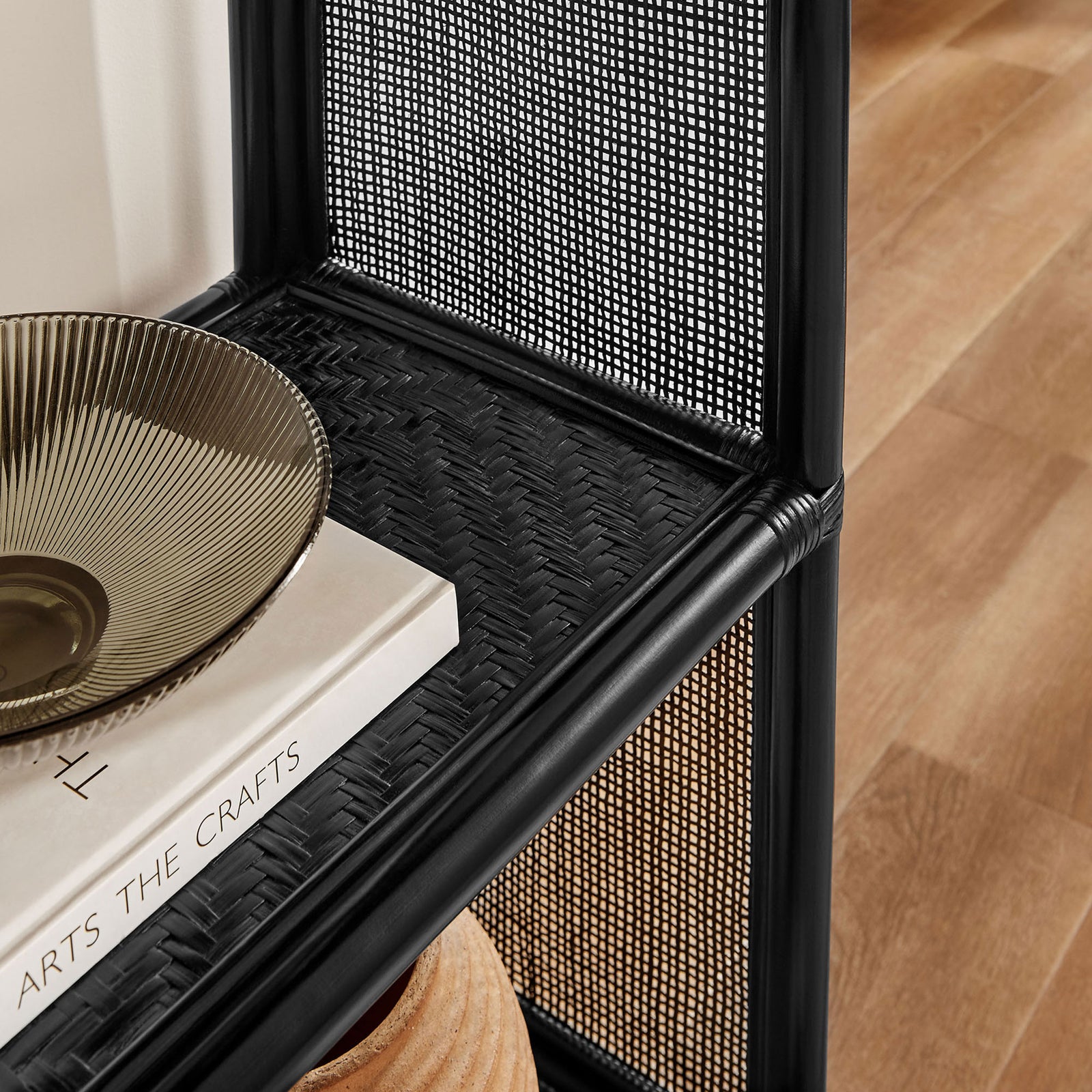 Textured black rattan surface adds depth to styled shelves in a modern living space || EEI-7363-BLK || detail_room