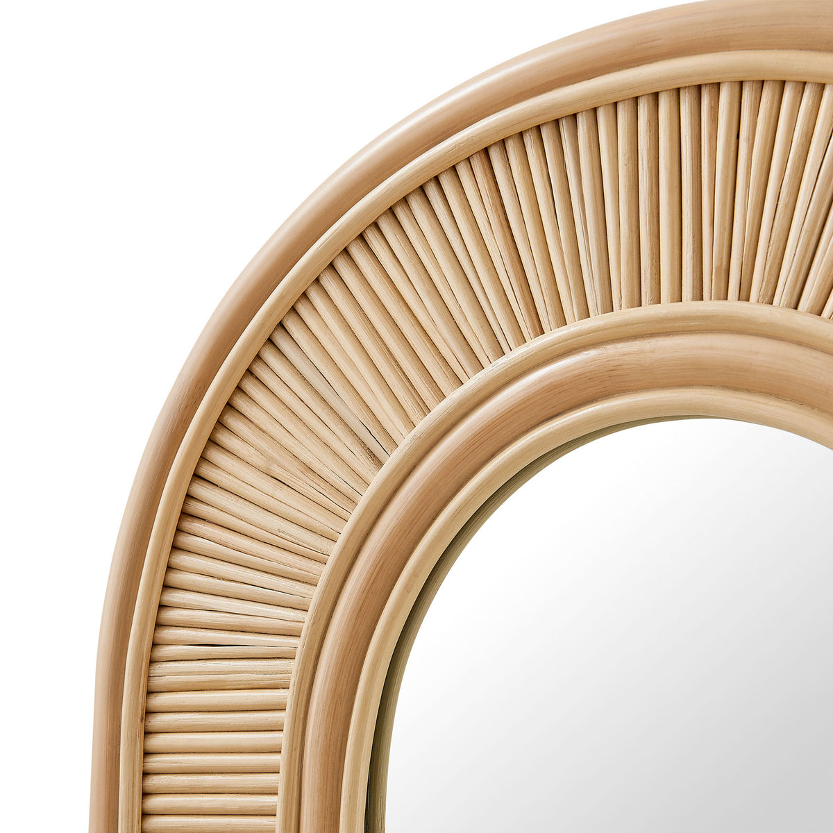 Tightly arranged natural rattan rods and smooth curved frame showcasing the mirror's rich texture and depth || EEI-7369-NAT || detail_studio