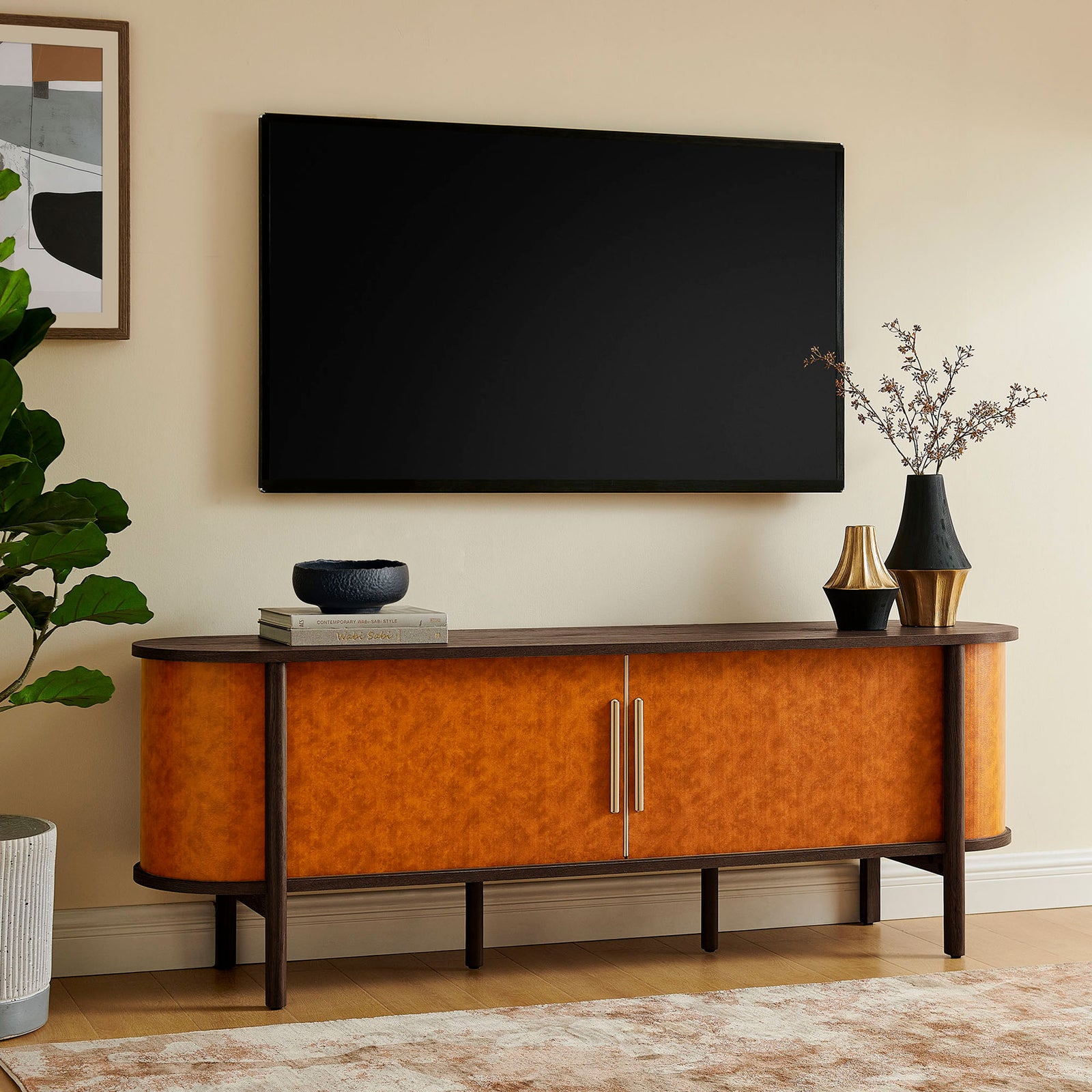 Coralie TV stand anchors a warm living room vignette, pairing walnut tones with bold vegan leather texture. || EEI-7372-WAL-TAN || front_room