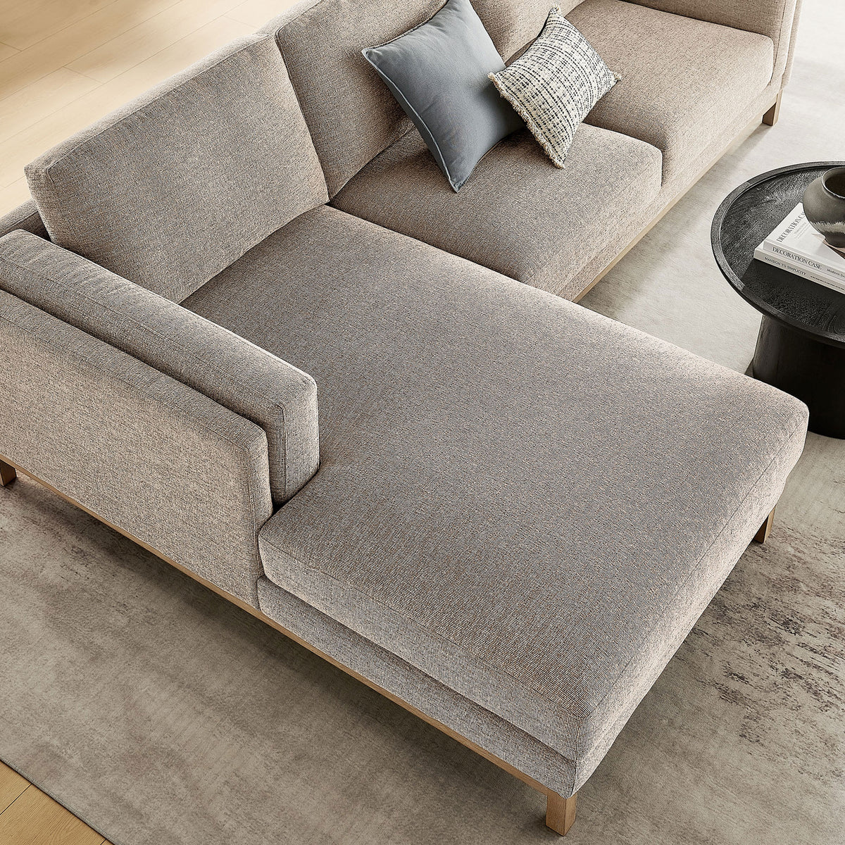 Chaise end of the Roscoe sectional showcasing melange chenille texture and inviting lounge space. || EEI-7374-PEW || detail_room