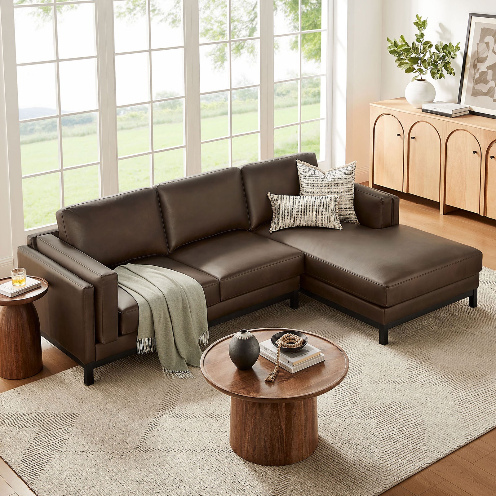 Roscoe right-facing espresso sectional styled with neutral rug, greenery, and layered accent pillows || EEI-7377-ESP || front_angle_room